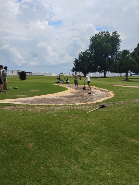 working on the greens at Brundidge Country Club